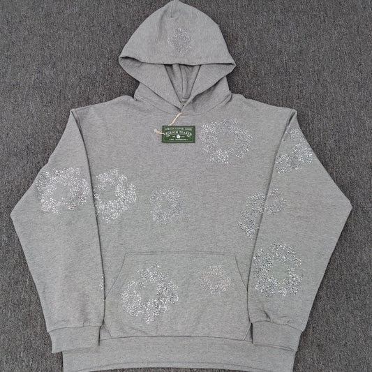 Gray hoodie with floral patterns on a gray background